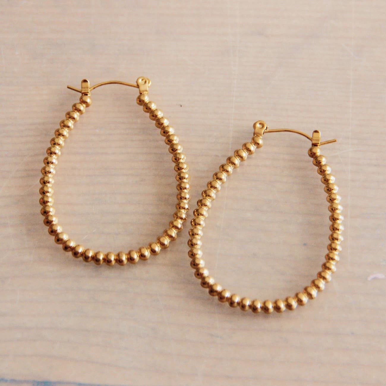 Stainless steel dotted oval earring